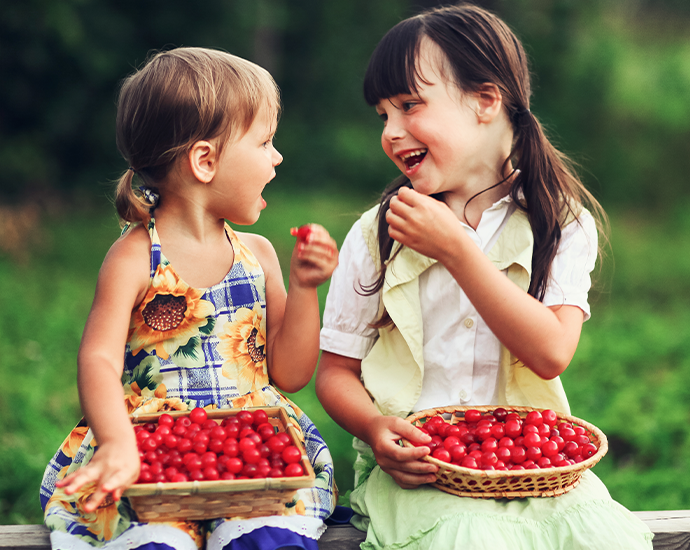 Children eating cherries